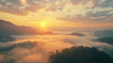 Obraz premium Misty Sunrise Over Rolling Hills and Valleys