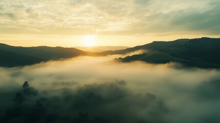 Sunrise Through Misty Valleys and Rolling Hills