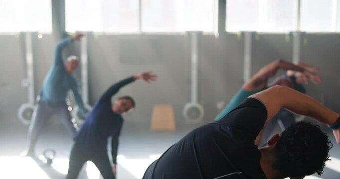 Fitness, stretching and personal trainer with mature people for training, exercise and warm up for workout. Sports, gym and coach with senior men and women for wellness, health or cardio for mobility