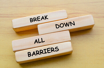 Break Down All Barriers text on wooden blocks. Against discrimination, racism and harassment concept