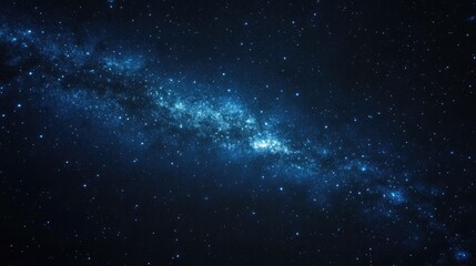 Obraz premium A starry night sky with the Milky Way galaxy visible, enhanced by the faint glow of light pollution from a distant city