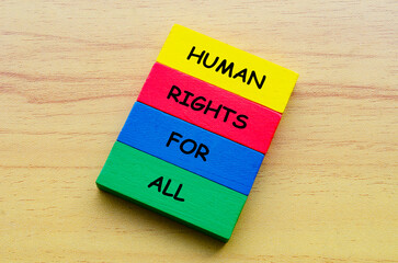 Top view of Human Rights For All text on multicolored wooden blocks. Against discrimination concept