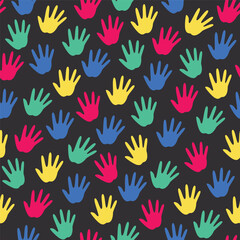 seamless pattern of colorful handprints on black background