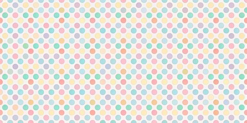 Fototapeta premium Pastel colored polka dots on a white background, ideal for fun and whimsical designs