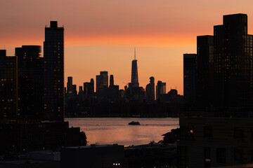 East River ferry and Manhattan sunset dusk view 