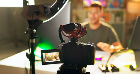Man, influencer and video recording with camera for online streaming, content creation or social...