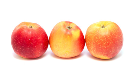 Three apples are lined up on a white background