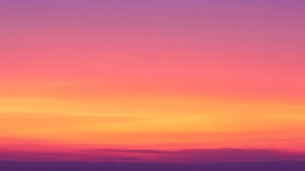Fototapeta premium A strikingly colorful sunset sky with gradients of pink, purple, and orange hues creating a beautiful and serene natural scene.