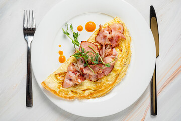 omelet with bacon and sauce