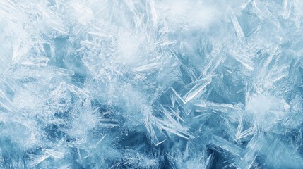 Obraz premium Close-up of detailed ice crystals, showcasing natural winter patterns and frosty textures in bright blue and white hues.