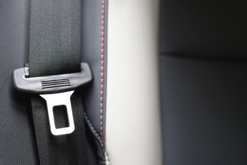 Close Up of fastening seat safety belt in car for before driving on the road. concept transport travel safety. soft focus.