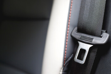 Close Up of fastening seat safety belt in car for before driving on the road. concept transport travel safety. soft focus.