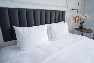 Bedroom with white bed with pillows