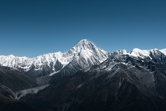 Minya Konka (Mount Gongga, Tibetan Snow Mountain) - in Sichuan Province, China. View from the west at Zimei Mountain Pass. Highest Mountain in Sichuan Province China.