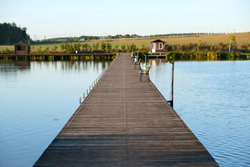 Obraz premium a floating pier or bridge for crossing a lake and fishing from the pier
