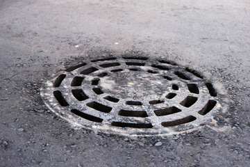 round grate for draining waste water, drainage, rolled into asphalt