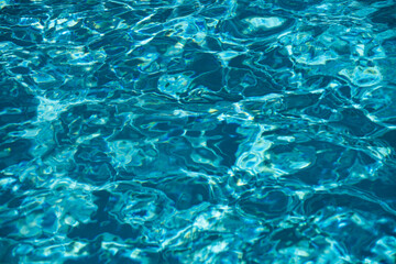 Blue ripped water in swimming pool, water pool texture and surface water backgraund.