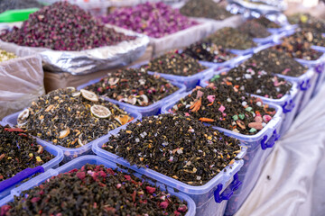 A table full of different colored spices