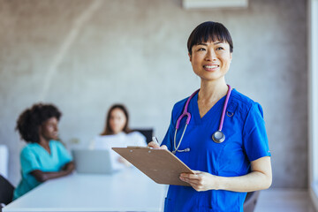 Confident Nurse Leader Conducting Medical Team Meeting in Office