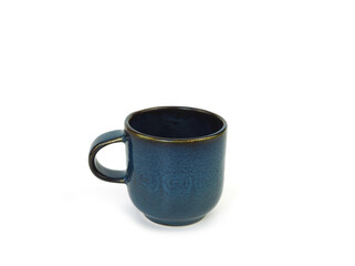 Empty dark blue mug isolated on white background. Use for home or restaurant, food design. Concept kitchen utensils and tableware. Side view..