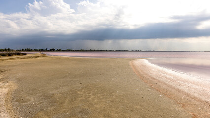 Obraz premium Clouds and rain over the Midi salt marshes, dead seaweed, France