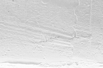 White Grunge Stucco Wall with Illuminated Light from Bottom.