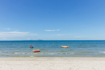Beach sea space area. Beautiful tropical beach and Inflatable boat with blue sky and white clouds in sunny day
