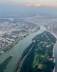 Aerial view of Bucharest showcasing the Dambovita River's passage through the city, symbolizing urban development and environmental balance