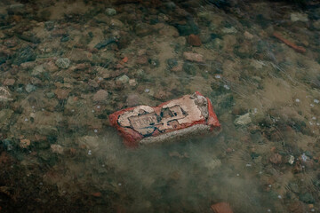 Discarded urban debris underwater symbolizing pollution and environmental issues