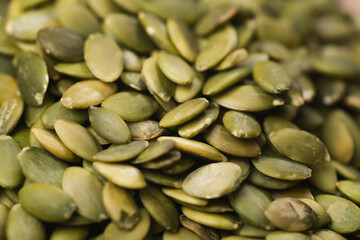green pumpkin seeds background close up
