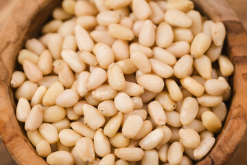pine nuts in wood bowl