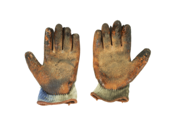 Dirty orange work gloves on white background.The mechanic's dirty gloves