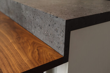 Closeup detail shot of gray terrazzo kitchen countertop with black marble