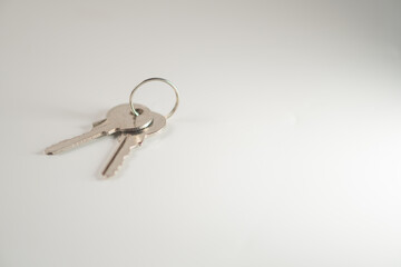 Close-up of Silver Keys on White Surface