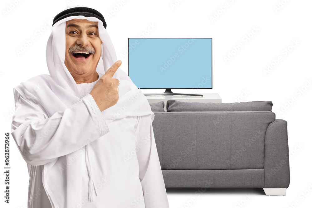 Wall mural Happy mature arab man pointing at a tv screen