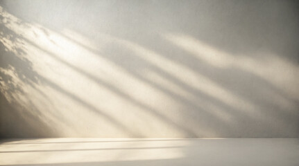 Minimalistic light background with blurred foliage shadow on wall