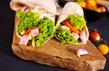 Fresh tortilla wraps with ham cheese and vegetables