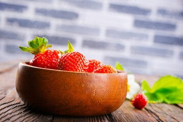 Close up of ripe organic strawberry food wooden table