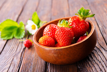 Close up of ripe organic strawberry food wooden table