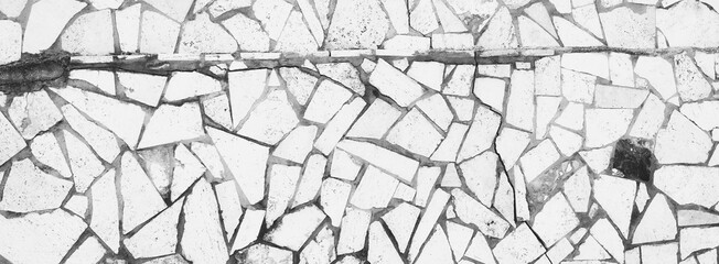 Obraz premium Grunge Broken Tiled Floor or Wall. Different Size tiles. Aged Surface. Rustic Texture. Black and white