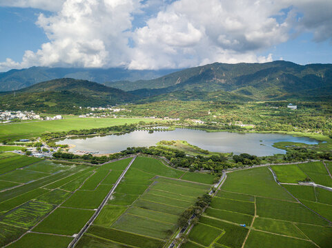 Scenic Aerial Panorama Drone Picture of the Rice Fields in front of the Mountains in Chishang, Taitung, Taiwan during Sunset