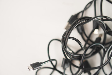 Tangled Black US B Cables on White Background