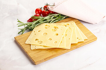 Sliced maasdam cheese with holes