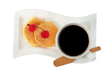 coffee cup with pancakes and cherry isolated
