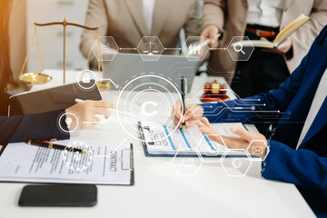 Copyright or patent concept, Business team analyzing data and using smart phone and tablet with virtual screen copyright icon