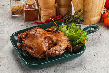 Baked small chicken with spices