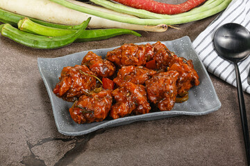 Manchurian chicken with sauce and spices
