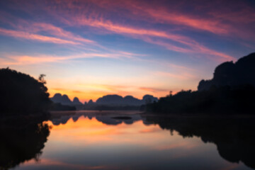 Blur image of Nong Thale lake and karst mountain at dawn, Krabi