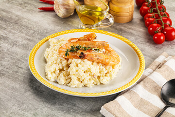 Italian risotto with prawn served thyme