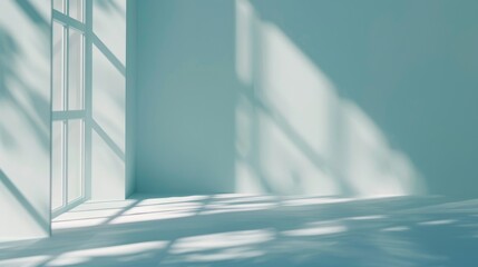 Obraz premium Gentle sunlight casts intricate shadows through large windows into an empty, serene room, creating a peaceful and minimalist ambiance.